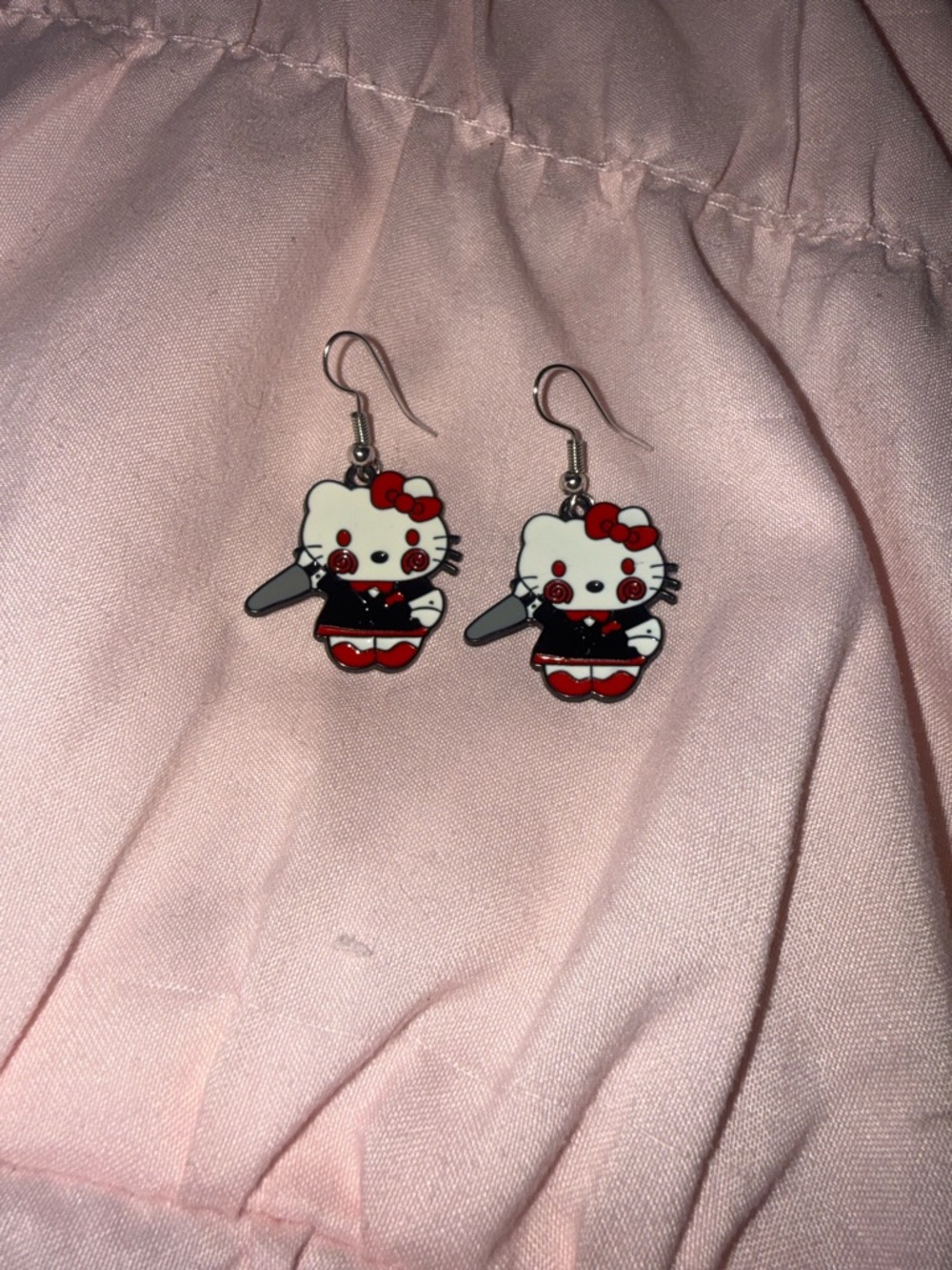 Hello kitty as billy from saw earrings